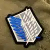 Embroidered anime emblem border and stitching detail