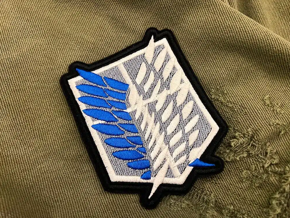 Embroidered anime emblem border and stitching detail