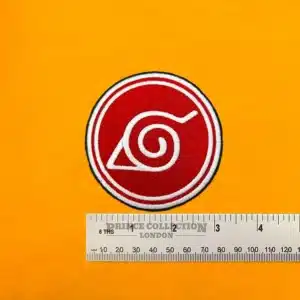 Embroidered Hidden Leaf Village symbol beside measurement ruler