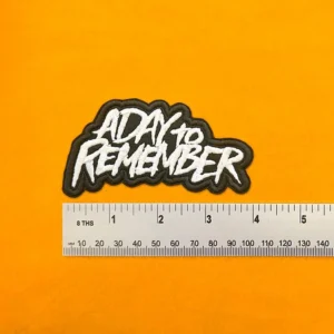A Day To Remember embroidered band patch beside measurement ruler