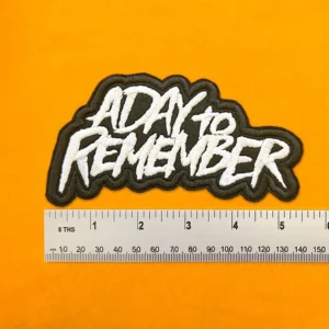 Embroidered band patch dimensions beside ruler