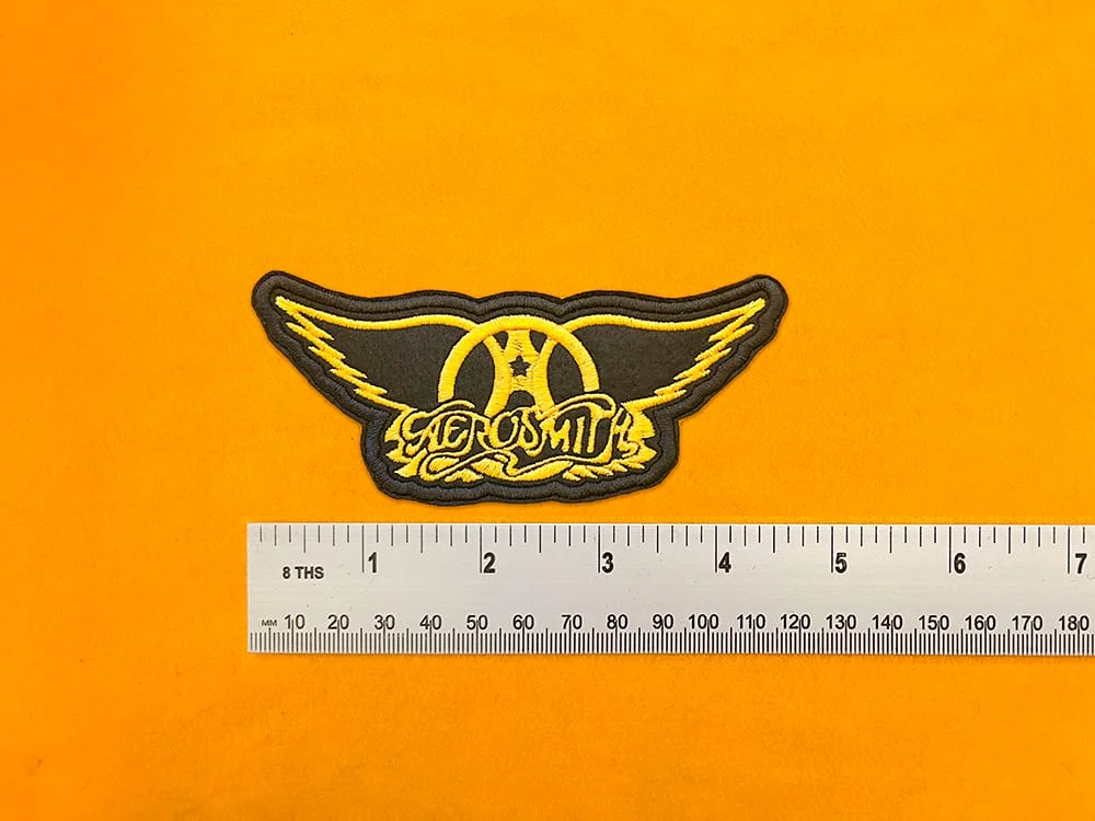 Aerosmith embroidered band patch beside measurement ruler