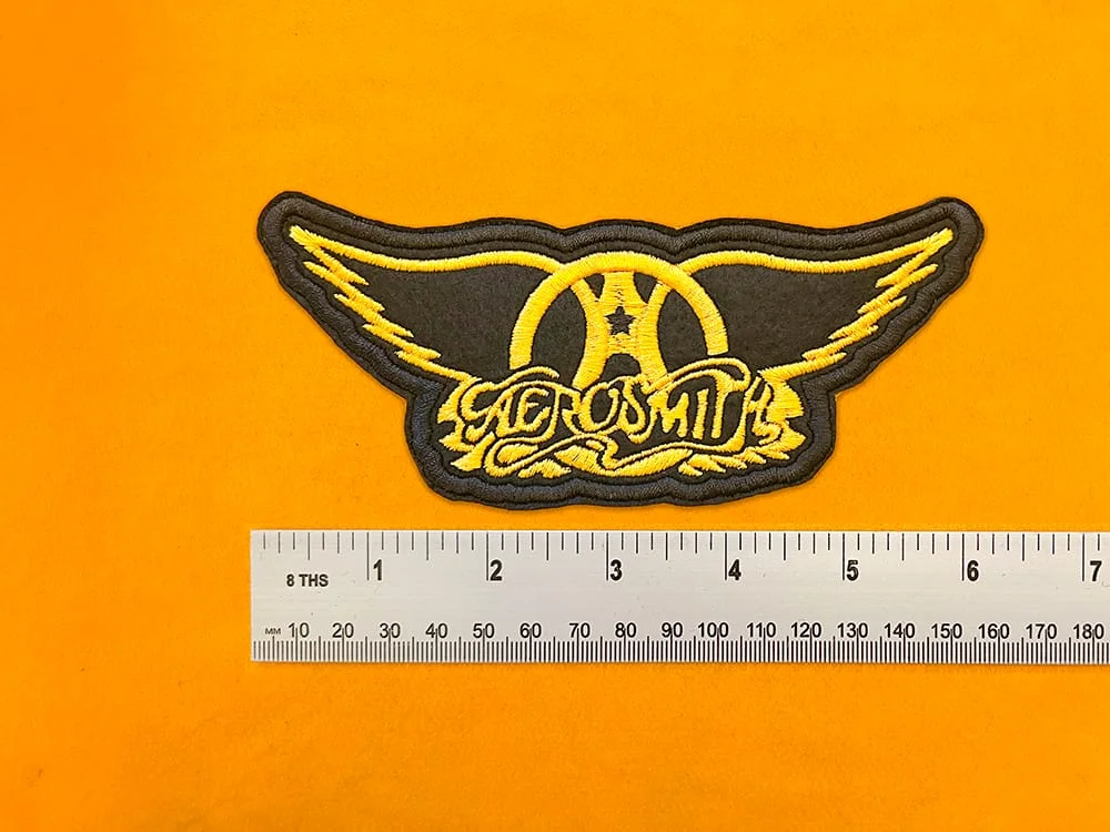 Embroidered band patch dimensions beside ruler