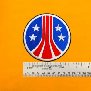 Embroidered Colonial Marines design beside measurement ruler