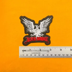 Alter Bridge embroidered band patch beside measurement ruler