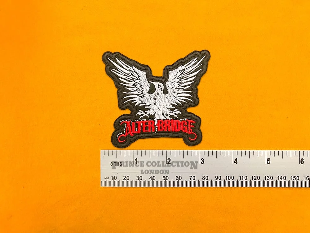 Alter Bridge embroidered band patch beside measurement ruler