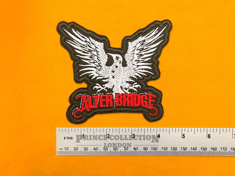 Embroidered band patch dimensions beside ruler