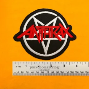 Embroidered Anthrax band design beside measurement ruler