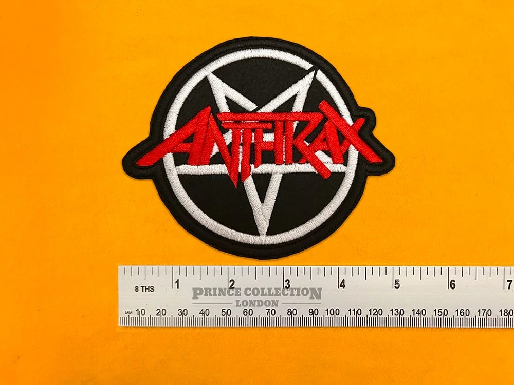 Embroidered Anthrax band design beside measurement ruler