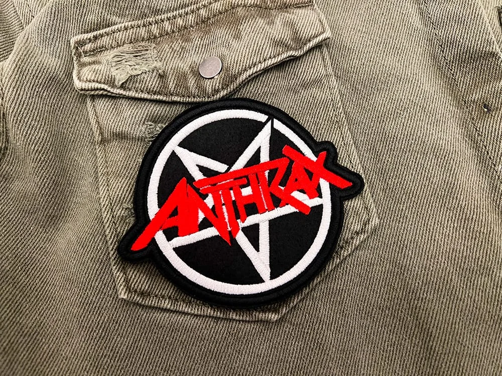 Embroidered thrash metal patch border and stitching detail