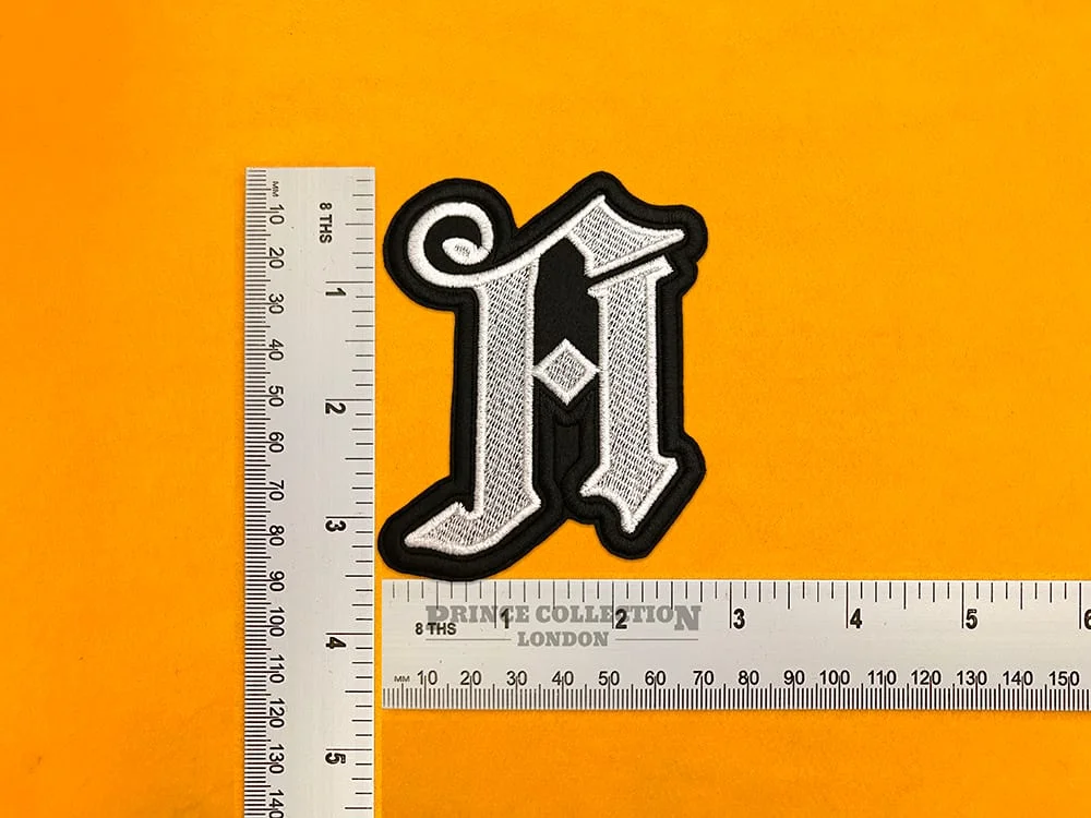 Architects band design beside measurement ruler
