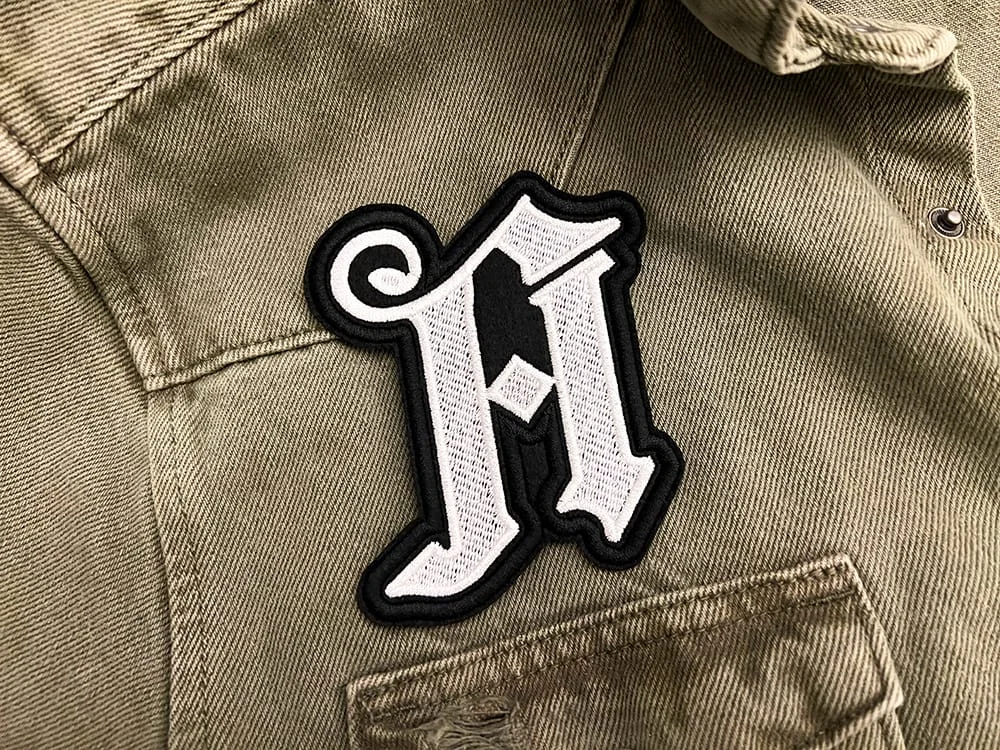Embroidered metalcore patch border and stitching detail