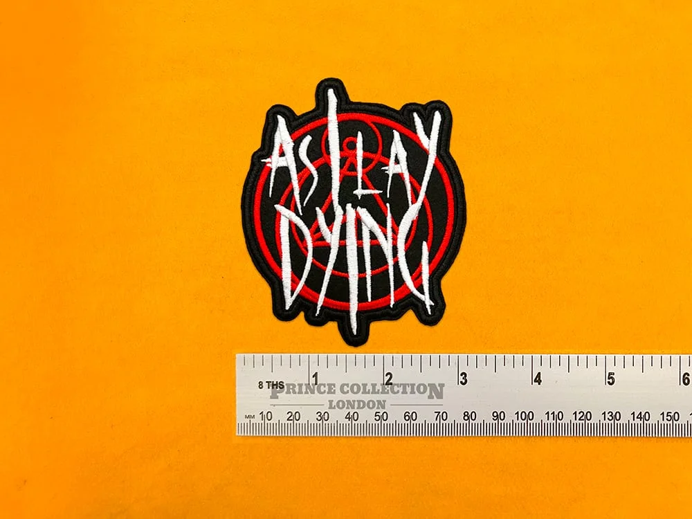 Embroidered As I Lay Dying design beside measurement ruler