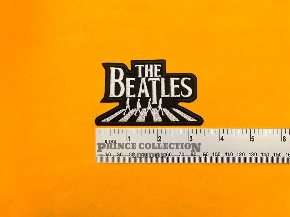 Alternative embroidered Beatles design beside measurement ruler