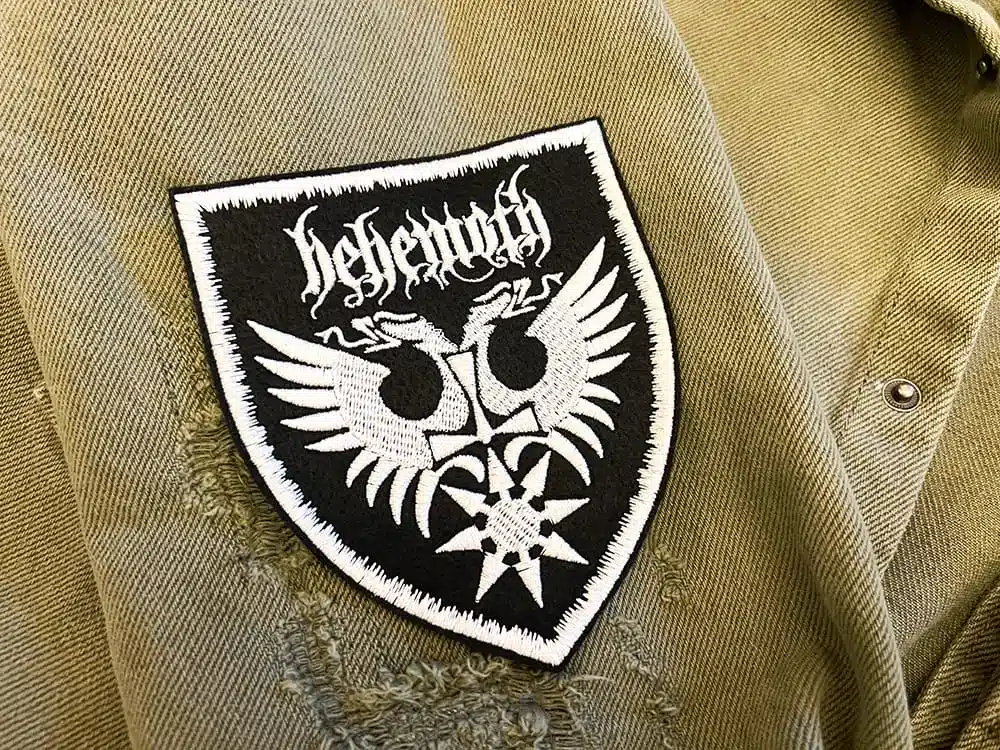Embroidered metal patch border and stitching detail