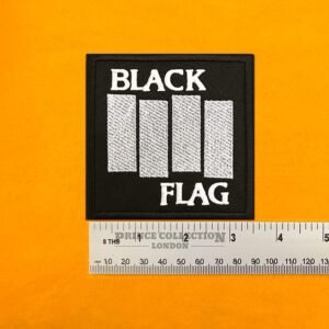 Embroidered Black Flag band design beside measurement ruler