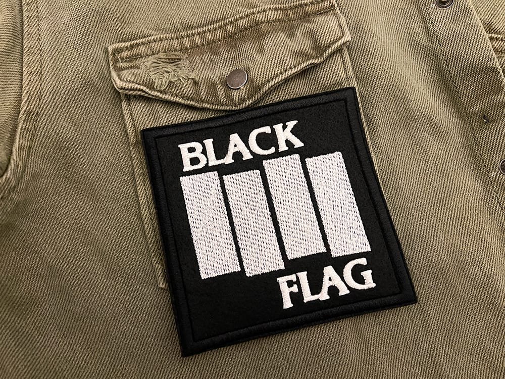 Embroidered punk patch border and stitching detail