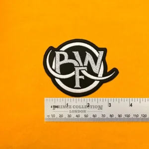 Embroidered Bleed From Within design beside measurement ruler