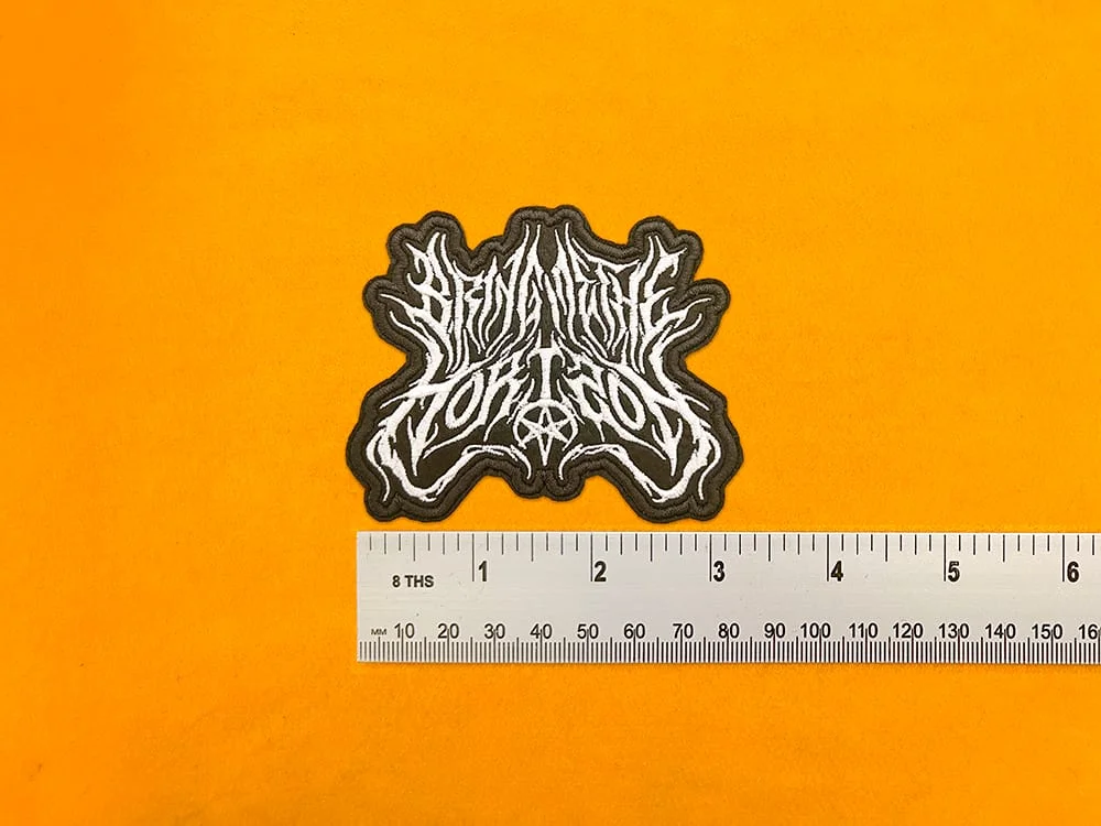 Bring Me The Horizon embroidered band patch beside measurement ruler