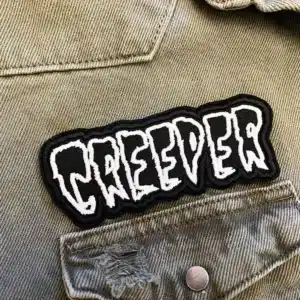 Black embroidered patch border and stitching detail