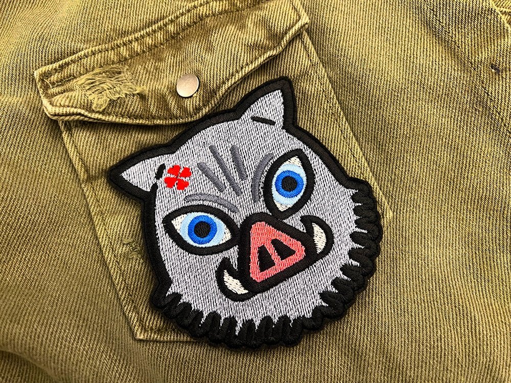 Embroidered anime patch border and stitching detail