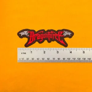 DragonForce embroidered band patch beside measurement ruler