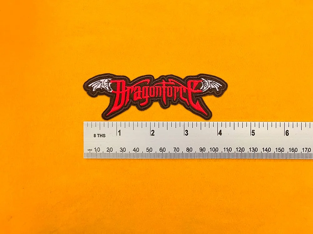 DragonForce embroidered band patch beside measurement ruler
