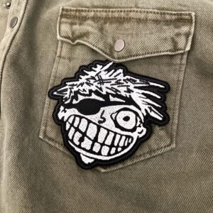 Embroidered punk rock patch border and stitching detail
