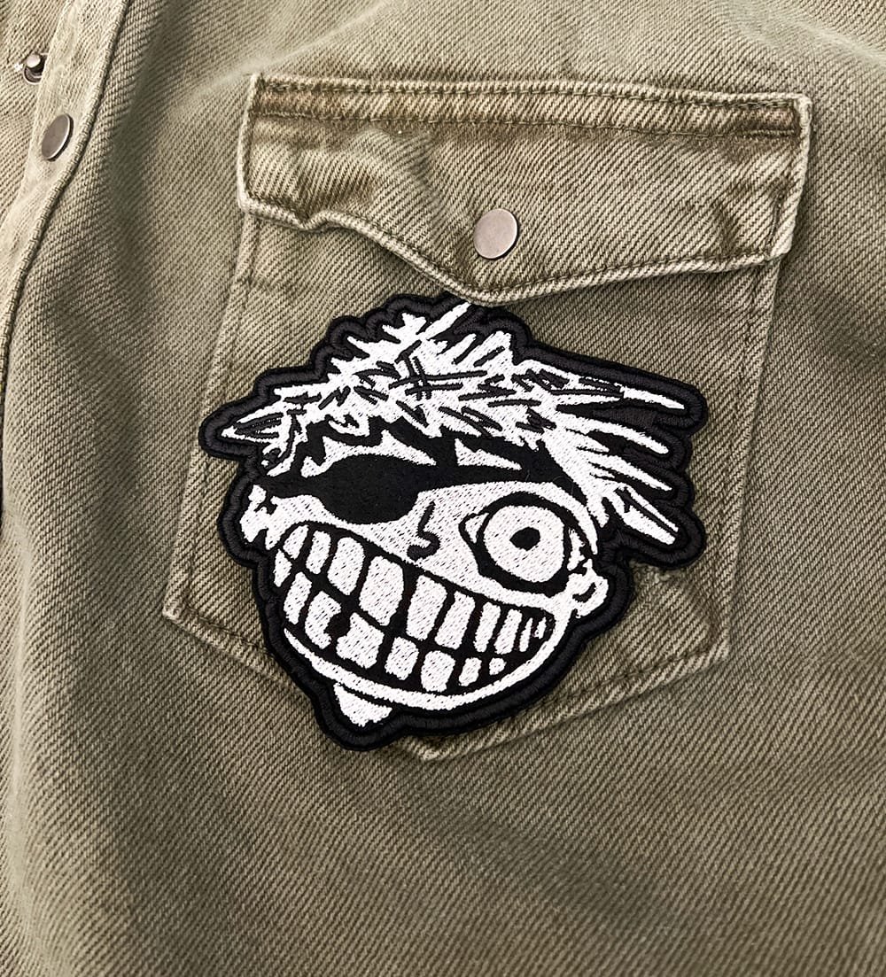 Embroidered punk rock patch border and stitching detail