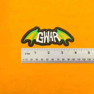 GWAR embroidered band patch beside measurement ruler