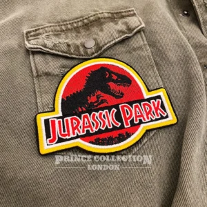 Embroidered dinosaur patch border and stitching detail