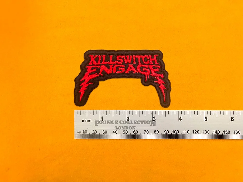 Embroidered Killswitch Engage design beside measurement ruler