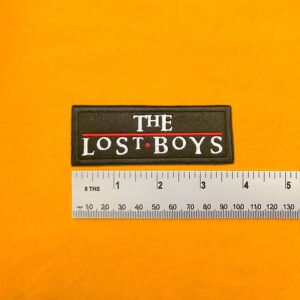 Embroidered vampire movie design beside measurement ruler