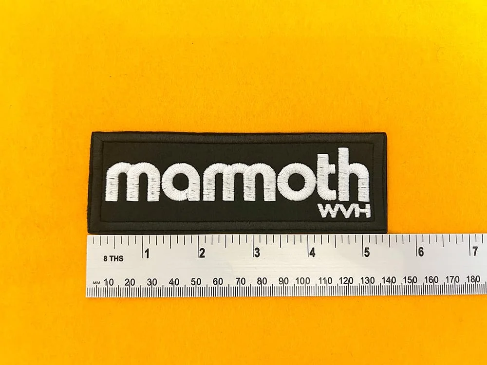 Embroidered Mammoth patch dimensions beside ruler