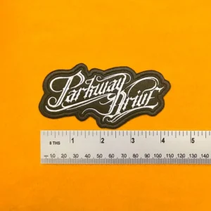 Parkway Drive embroidered band patch beside measurement ruler