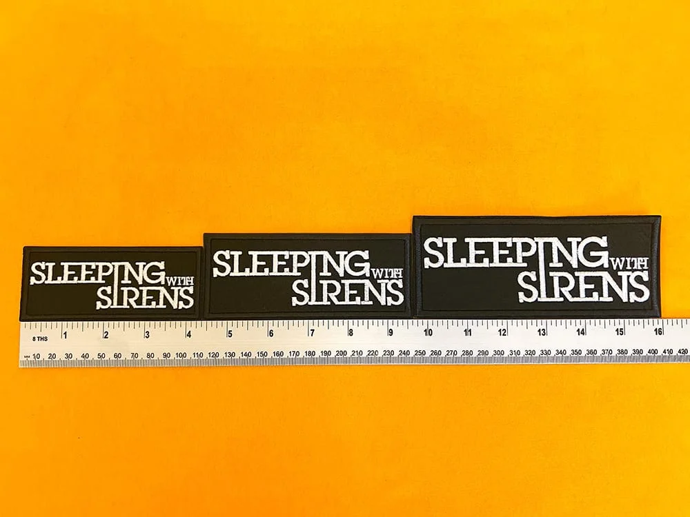 Sleeping With Sirens embroidered band patch beside measurement ruler