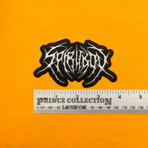 Embroidered Spiritbox band design beside measurement ruler