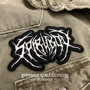 Embroidered metal band patch border and stitching detail