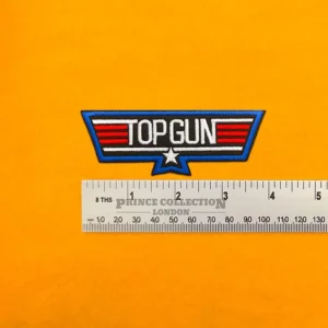 Embroidered aviation wings design beside measurement ruler