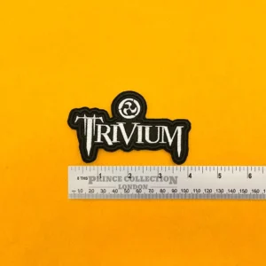 Embroidered band patch beside measurement ruler