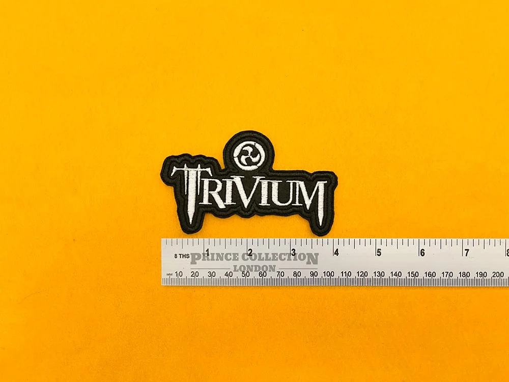 Embroidered band patch beside measurement ruler