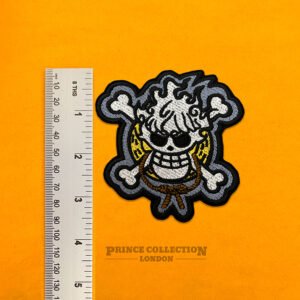 Close-up of embroidered anime patch stitching