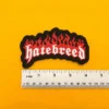 Embroidered Hatebreed design beside measurement ruler