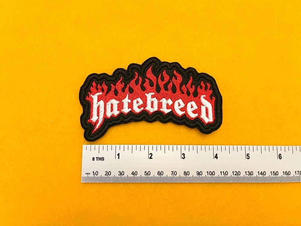 Embroidered Hatebreed design beside measurement ruler