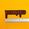 Embroidered Ice Nine Kills design beside measurement ruler