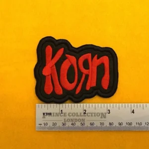 Embroidered Korn design beside measurement ruler