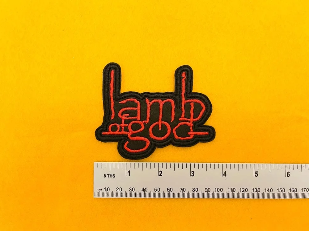 Lamb of God embroidered band patch on denim battle jacket