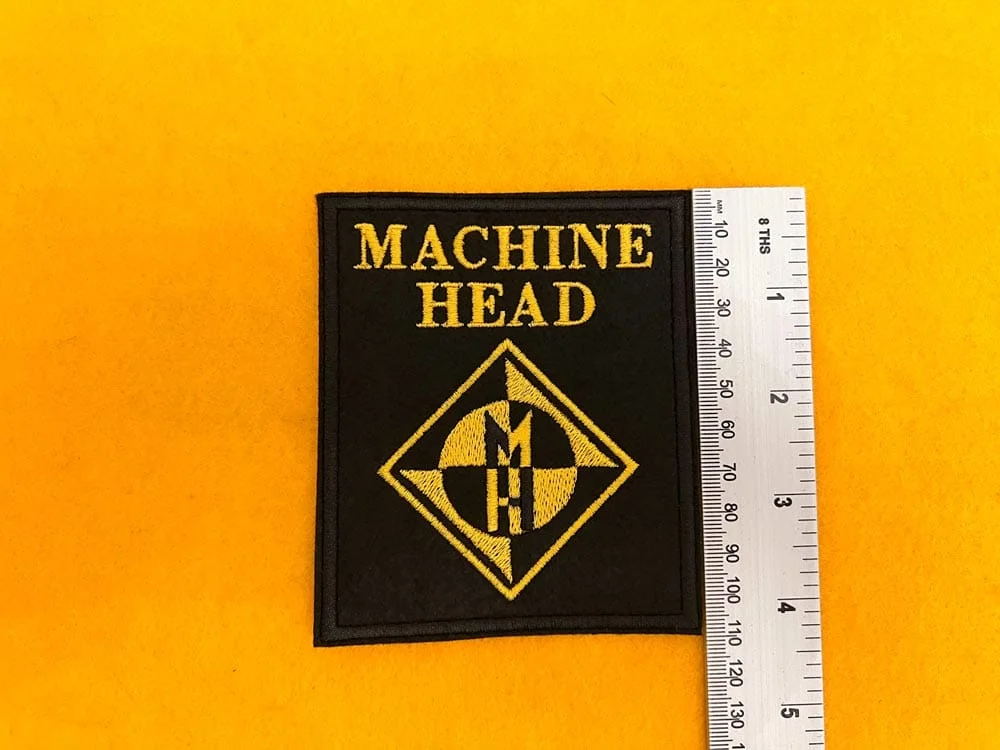 Machine Head embroidered band patch beside measurement ruler