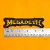 Embroidered Megadeth design beside measurement ruler