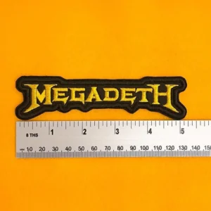 Embroidered Megadeth design beside measurement ruler